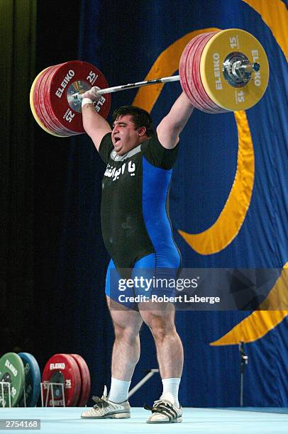 Hossein Reza Zadeh of Iran lifts 207.5 Kilograms in the Snatch competition during the Men's +105 KG Group A Final competition at the 2003 World...