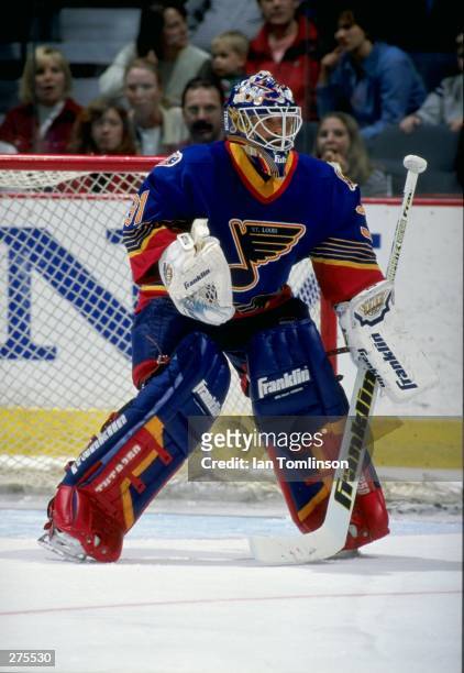 Goaltender Grant Fuhr of the St. Louis Blues in action during a game against the Calgary Flames at the Saddledome in Calgary, Alberta Canada. The...