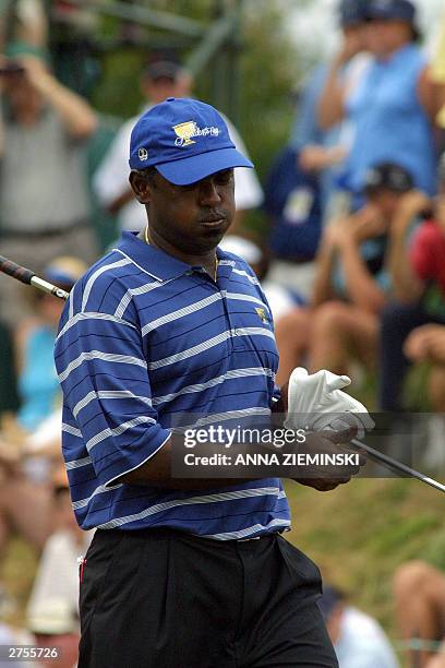 Fiji's Vijay Singh looks apprehensive on the 3rd hole during his singles match with US Justin David Toms at The President's Cup golf tournament at...