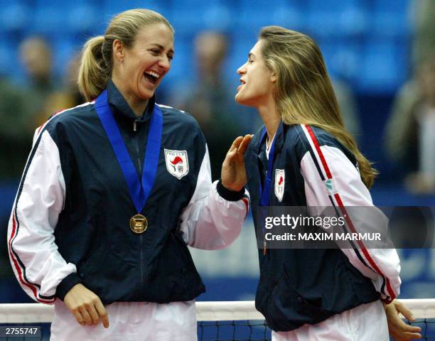 Russian Federation: Mary Pierce and Amelie Mauresmo of France laught during the trophee ceremony, 23 November 2003 at Olympic stadium in Moscow,...