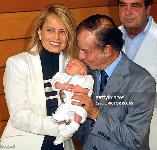 Carlos Menem , a controversial figure as Argentina's president from 1989-1999, and his Chilean-born wife, former beauty queen, Cecilia Bolocco , hold...