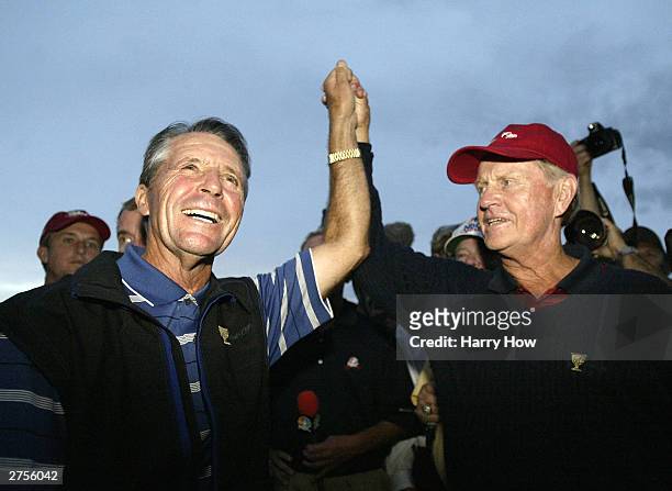 Captain Jack Nicklaus and International Team Captain of Gary Player of South Africa raise each others hands in ending the match in a 17-17 draw...