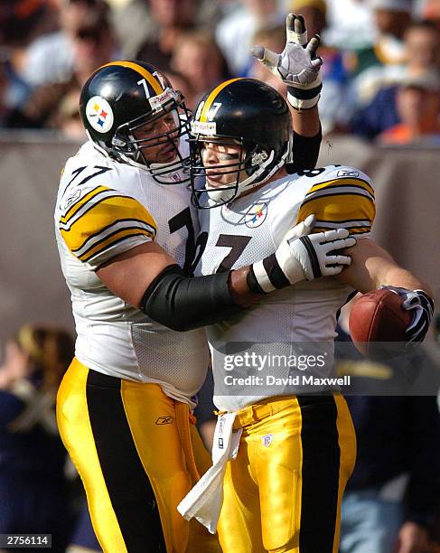 Tight end Mark Bruener of the Pittsburgh Steelers celebrates with teammate Marvel Smith after catching a touchdown pass from quarterback Tommy Maddox...