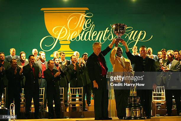 President of South Africa Thabo Mbeki presents the President's Cup to Captain Jack Nicklaus of USA and International Captain Gary Player of South...