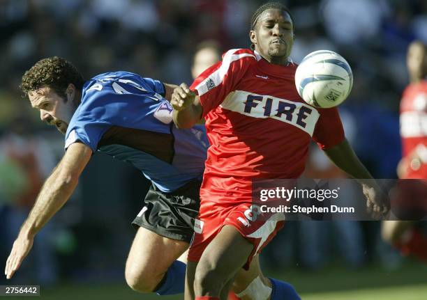 Damani Ralph of the Chicago Fire dribbles against the defense of Troy Dayak of the San Jose Earthquakes in the first half of the MLS Cup on November...