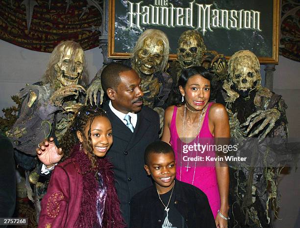 Cast members Eddie Murphy, Marsha Thomason, Aree Davis and Marc John Jeffries pose at the premiere of "The Haunted Mansion" held on November 23, 2003...