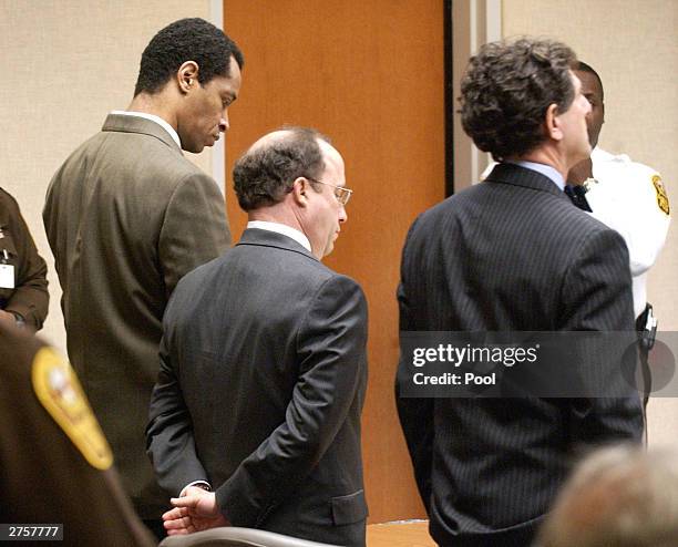 Convicted sniper John Allen Muhammad stands with his defense attorneys Peter Greenspun and Jonathan Shapiro as the jury recommendation of death is...