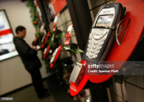 Verizon cell phones are shown on display at a store November 24, 2003 in New York City. U.S. Cell phone customers can now switch carriers without...