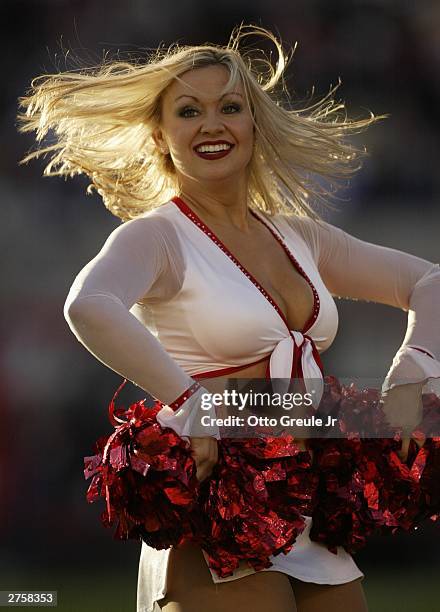 Member of the Arizona Cardinals' cheerleading squad performs a dance routine on November 23 2003 at Sun Devil Stadium in Tempe, Arizona.