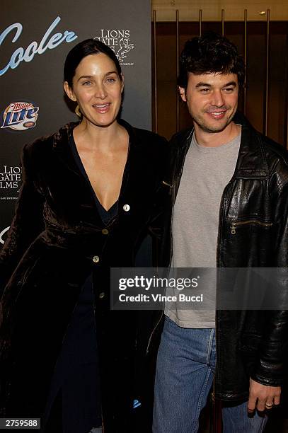 Actress Carrie-Anne Moss and husband Steven Roy attend the premiere of "The Cooler" held on November 24, 2003 at the Egyptian Theater, in Los...