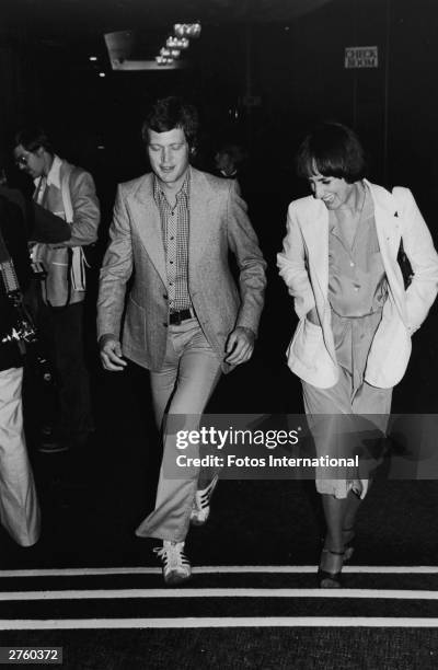 American television host David Letterman walks with an unidentified woman, attending a S.H.A.R.E. Party at the Hollywood Palladium, Hollywood,...