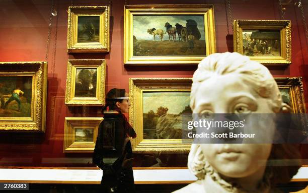 Lady views the work of artist John Constable at the Victoria & Albert Museum's new suite of galleries on November 25, 2003 in London, England. Works...