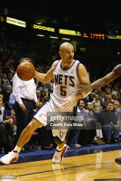 Jason Kidd of the New Jersey Nets moves the ball against the New Orleans Hornets during the game at Continental Airlines Arena on November 18, 2003...