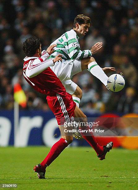 Jackie McNamara of Celtic clashes with Michael Ballack of Bayern during the UEFA Champions League Group stage match between Glasgow Celtic and Bayern...