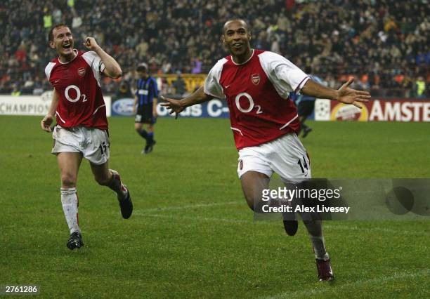 Thierry Henry of Arsenal celebrates scoring their third goal during the UEFA Champions League Group B match between Inter Milan and Arsenal at the...