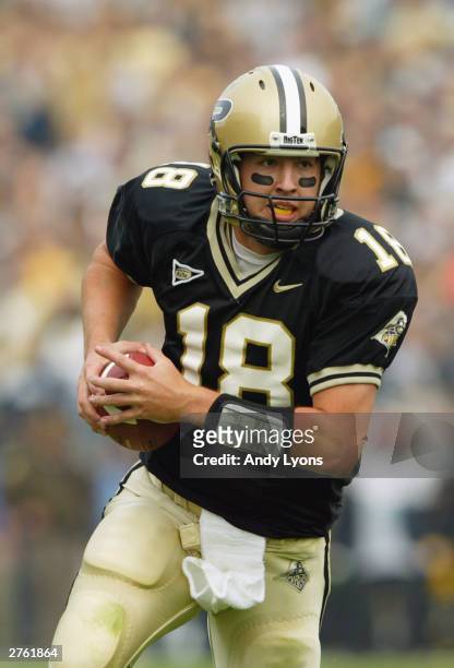 Kyle Orton of Purdue runs with the ball against Northwestern during the game on November 1, 2003 at Ross-Ade Stadium in West Lafayette, Indiana....