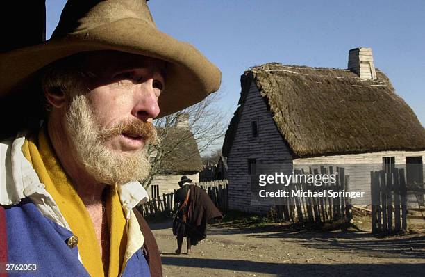 Scott Atwood, who portrays pilgrim Robert Hicks, looks across the main street of Plimoth Plantation November 25, 2003 at Plimoth Plantation in...