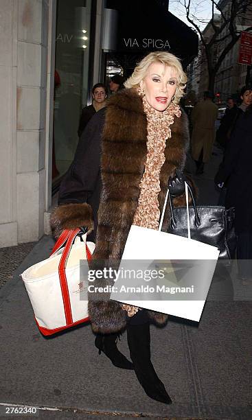Joan Rivers exits Luca Luca Boutique on 63rd and Madison, after doing some holiday shopping November 25, 2003 in New York City.