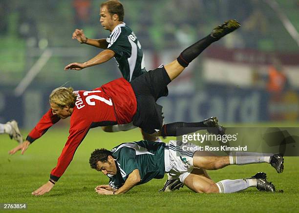 Diego Forlan of Manchester is challenged by Ioannis Goumas of Panathinaikos during the UEFA Champions League Group E match between Panathinaikos and...