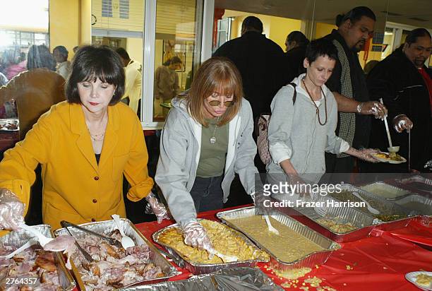 Actresses Cindy Williams, Penny Marshall and Lori Petty serve food at A Place Called Home, which provides at-risk youth with "a secure, positive...