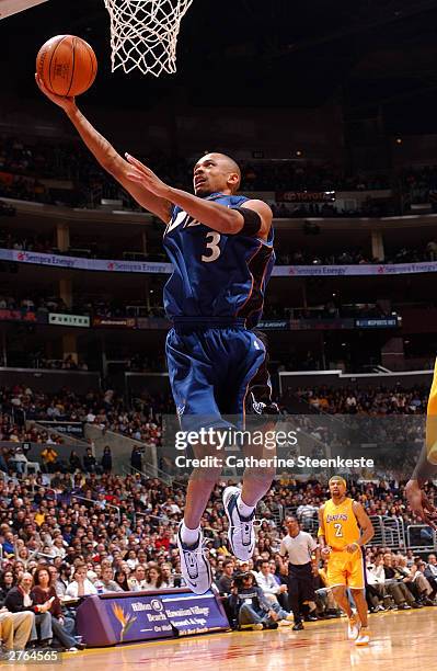 Juan Dixon of the Washington Wizards attempts a shot past the Los Angeles Lakers November 26, 2003 at Staples Center in Los Angeles, California. NOTE...