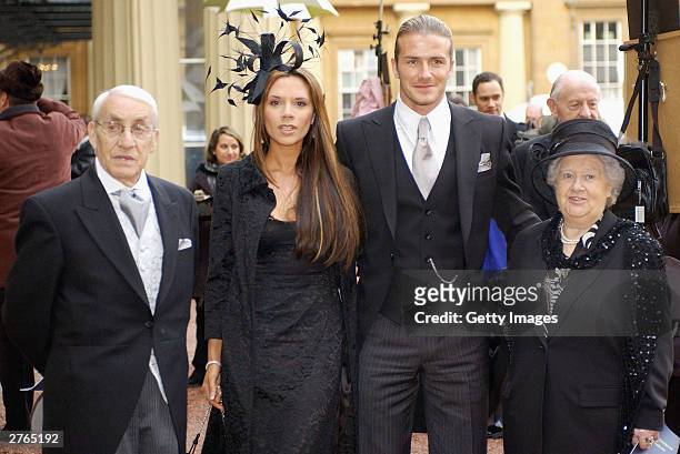 England football captain David Beckham with his wife Victoria and his maternal grandparents, Joseph and Peggy West meet the press after he received...