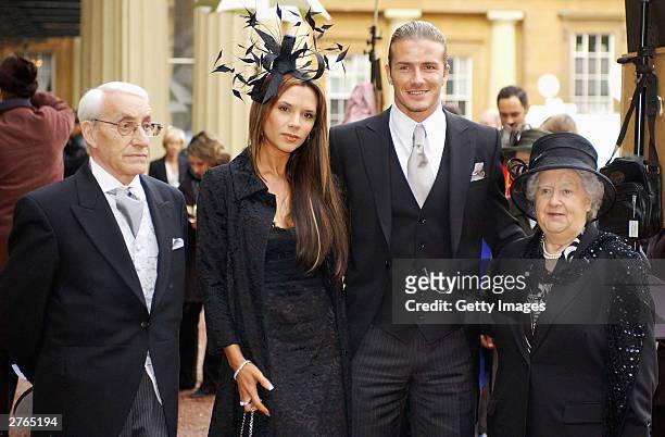 England football captain David Beckham with his wife Victoria and his maternal grandparents, Joseph and Peggy West meet the press after he received...