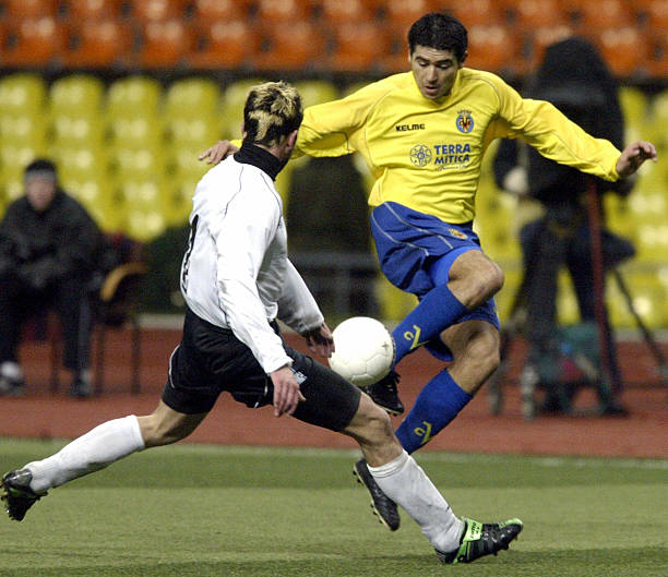 Nikola Jolovich from Moscow's Torpedo battles for the ball against Roman Riquelme Juan from Spanish Villarreal during their UEFA Cup second-round,...