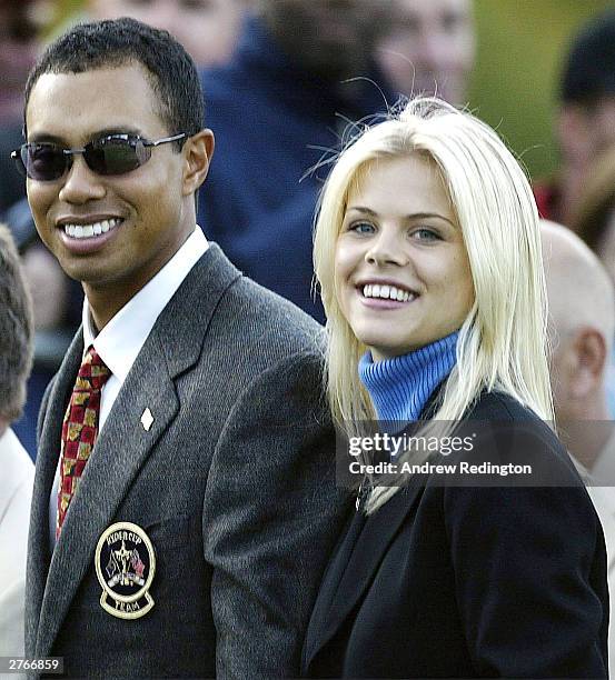 Golfer Tiger Woods poses with girlfriend Elin Nordegren during the opening ceremony for the 34th Ryder Cup in this September 26, 2002 file photo in...