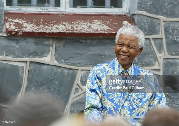 Nelson Mandela outside his former prison cell attends a press conference for "46664 - Give One Minute of Your Life to AIDS" on November 28, 2003 on...