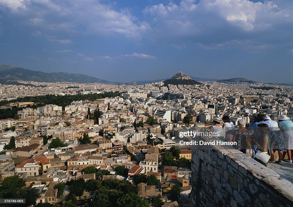 Greece,Athens,tourists at Acropolis overlooking city,Lycabettus Hill