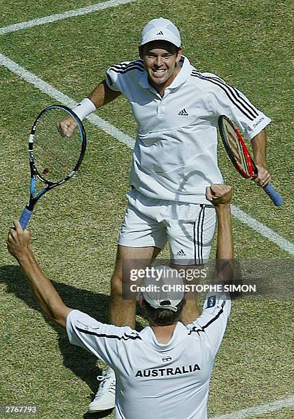 Australians Todd Woodbridge jubilates with Wayne Arthurs after they won match point in the Davis Cup final between Australia and Spain at Rod Laver...