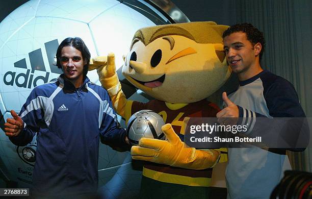 Nuno Gomez and Sabrosa Simao of Portugal with Ninas the official Euro 2004 mascot and the Euro 2004 Roteiro Ball during the Adidas Rotiero Ball...