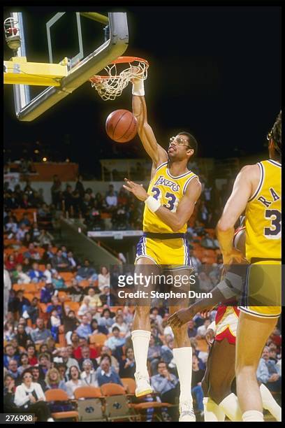 Center Kareem Abdul-Jabbar of the Los Angeles Lakers slams an easy two-pointer over the Atlanta Hawks during a game at The Forum in Inglewood,...