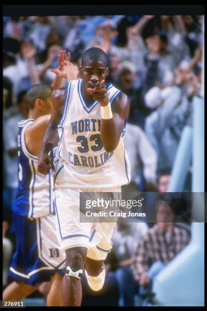 Forward Antawn Jamison of the North Carolina Tar Heels heads up court at full speed during a game against the Duke Blue Devils at the Dean Smith...