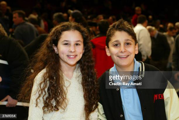 Actors Hallie Eisenberg & Daniel Tay celebrate Kids Day at the New York Knicks - New Orleans NBA game November 29, 2003 at Madison Square Garden in...