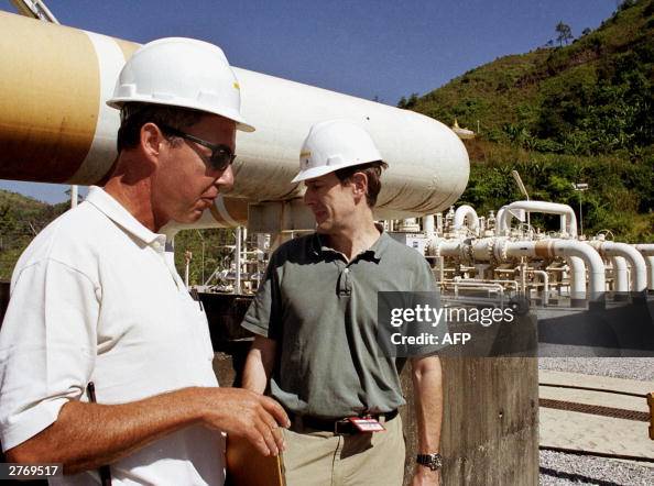An unidentified official (L) of French o An unidentified official (L) of French o