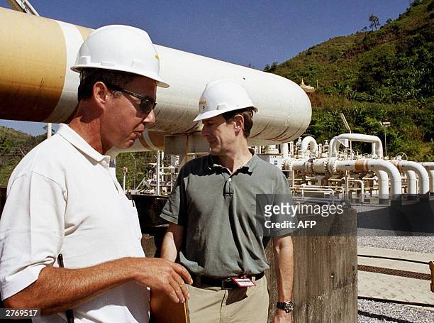An unidentified official of French oil campany Total briefs visiting media at the metering junction of a gas pipeline in Nat-En-Tong, border town of...
