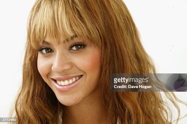 Singer Beyonce Knowles poses for a portrait in a studio at the "46664 - Give One Minute of Your Life to AIDS" concert at Greenpoint Stadium on...