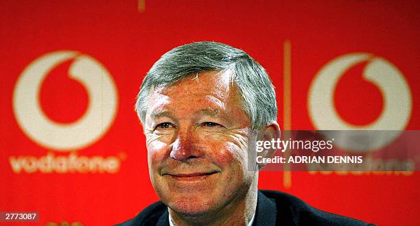 Manchester United's Manager Sir Alex Ferguson smiles during a press conference announcing a new sponsorship deal with the mobile phone company...