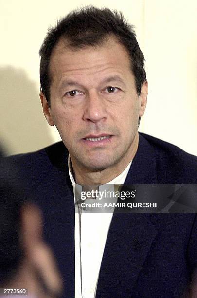 Pakistani cricket hero-turned politician and chief of Tehrik-i-Insaf , Imran Khan gestures while addressing a press conference in Karachi, 01...