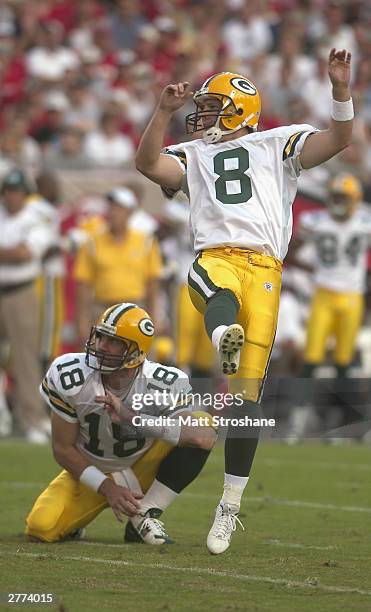 Tampa, FL Kicker Ryan Longwell of the Green Bay Packers kicks the football as Doug Pederson holds the ball during the game against the Tampa Bay...