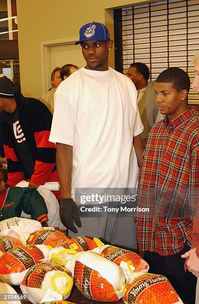 LeBron James of the Cleveland Cavaliers during the LeBron James Holiday Turkey Giveaway at Acme Supermarket on November 24, 2003 in Akron, Ohio. NOTE...