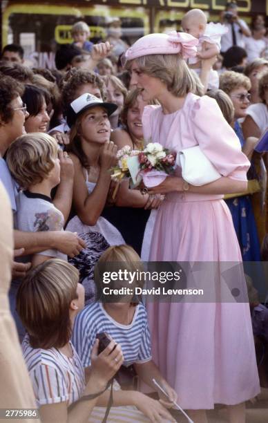 Diana Princess of Wales and Prince Charles visit Maitland, Australia on March 29, 1983 during the Royal Tour of Australia. Diana wore a dress by...