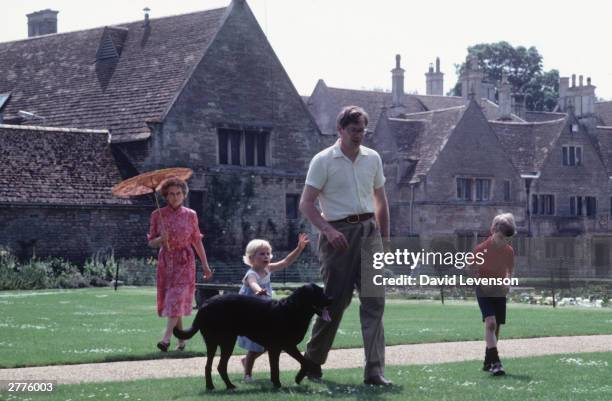 Princess Alice Duchess of Gloucester with the Duke of Gloucester and Lady Davina Windsor and Alexander, the Earl of Ulster in the garden of Barnwell...
