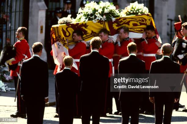 Watched by Prince Charles, Prince Harry, Earl Spencer, Prince William and the Duke of Edinburgh, Guardsmen of the Prince of Wales Company of the...