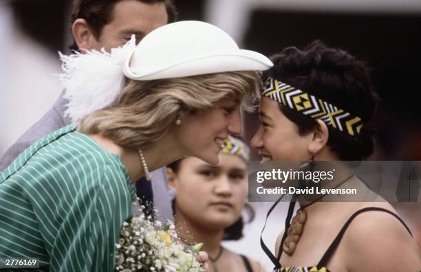 Diana Princess of Wales is given the traditional Maori greeting of a nose rub in the Eden Park Stadium, on her arrival on April 18, 1983 in Auckland,...