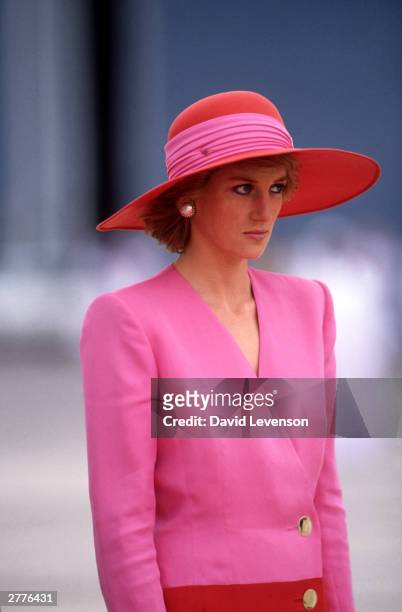 Diana Princess of Wales arrives in Dubai, United Arab Emirates, during the Royal Tour of the Gulf in March 1989. Diana wore a dress by Catherine...