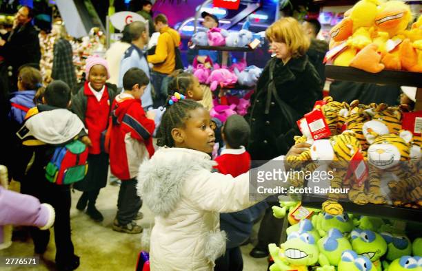 Children look at toys inside of Hamley's Toy Store December 2, 2003 in London, England. A survey has found that a third of British Christmas shoppers...