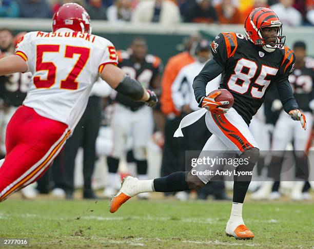 Wide receiver Chad Johnson of the Cincinnati Bengals evades linebacker Mike Maslowski of the Kansas City Chiefs during the game at Paul Brown Stadium...